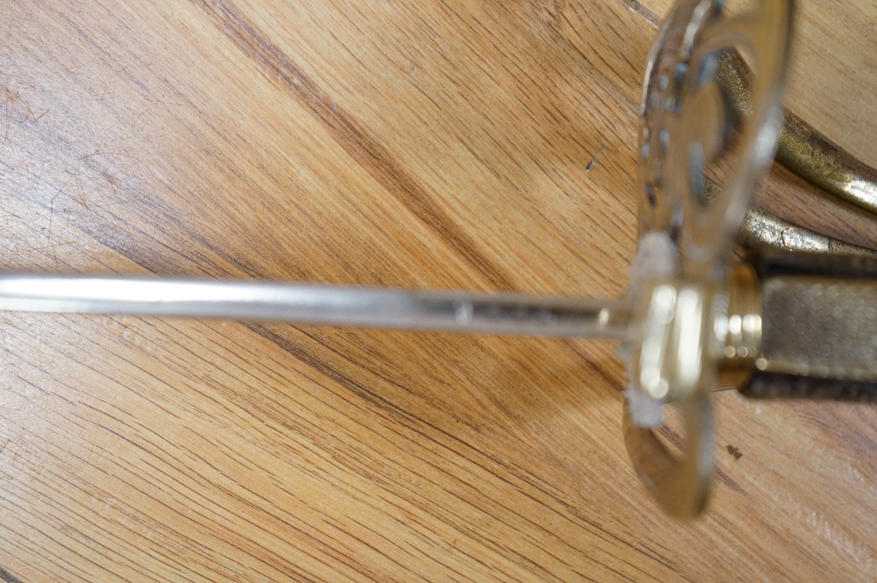 A post 1902, 1827 pattern Rifle Brigade officer’s dress sword, with regulation blade with traces of edge decoration, regulation nickel guard with crown strung bugle and wire bound fish skin covered grip, in its steel sca